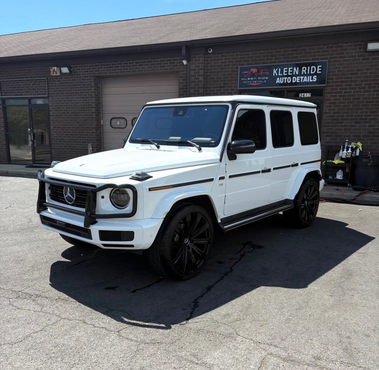 White Mercedes-Benz G-Wagon hand-washed outside Kleen Ride Auto Details in Waldorf, MD