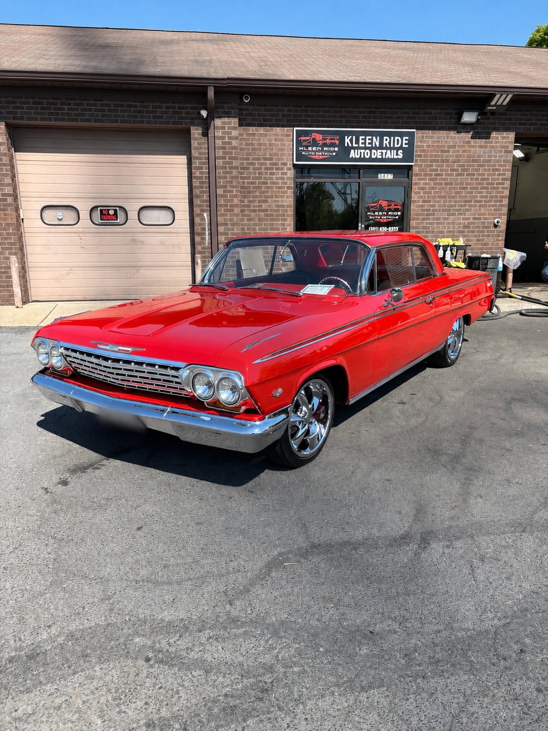 Restored red 1962 Chevrolet Impala classic car hand-washed at Kleen Ride Waldorf